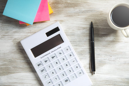 Business analysis concept. Calculator with papers and coffeeの写真素材