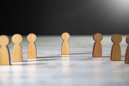 team concept, wooden figures people standing