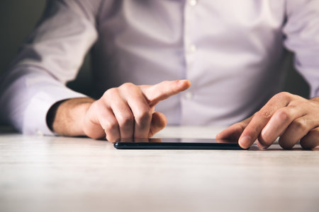 hands holding the touch screen device, technology concpetの写真素材