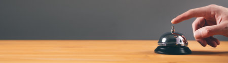 man finger on the call button on tableの写真素材