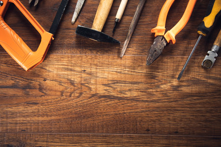 Different Tools on a wooden background.の写真素材