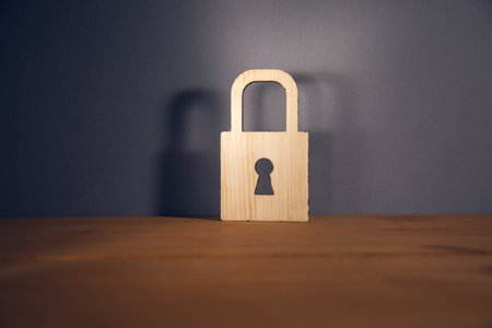 wooden lock on wooden table, Technology security insurance conceptの写真素材