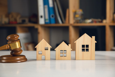 Judge gavel and model house. Concept of real estate auctionの写真素材