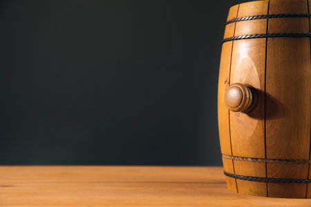 vintage oak barrel on a wooden table backgroundの写真素材