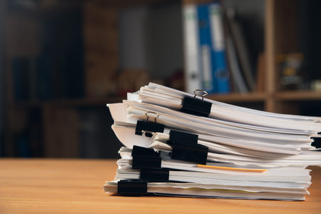 Stack of report paper documents. Concept of business and financial data analysisの写真素材