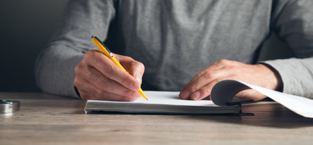 business man hand is signing a contract In the agreement