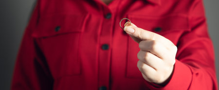 The young woman holding wedding ring.の写真素材