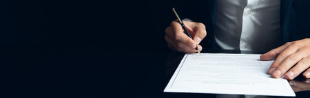 business man hand is signing a contract In the agreement