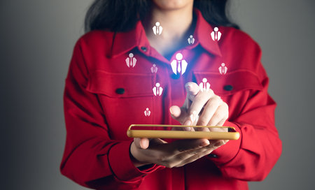 Woman hand holding a phone show the social networkの写真素材