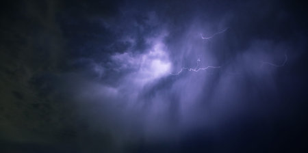 Dramatic background - dark sky and clouds with lightnings