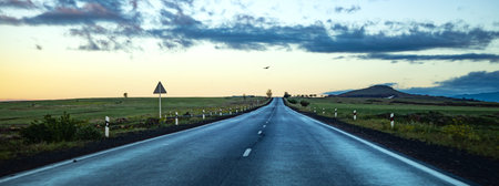 The road curves beautifully in the morning and evening.