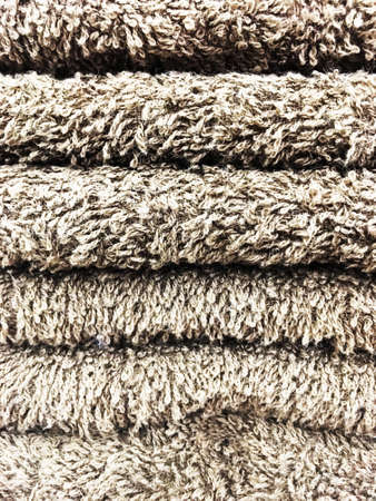 Stack of different gray towel.