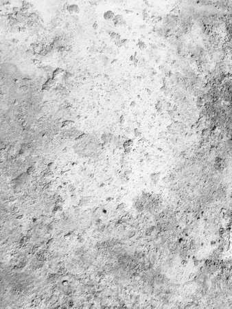 Background of cracked wall with holes and dirty splashes.の写真素材