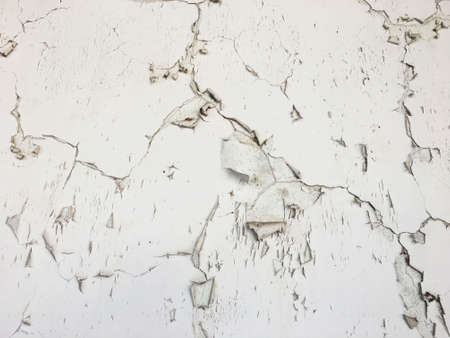 white wall with cracks.