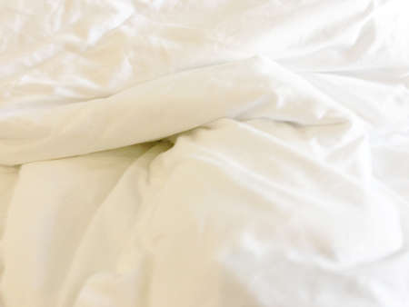 Soft smooth white silk fabric background. Fabric texture.