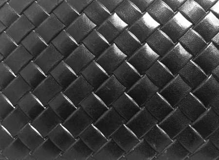 Braided texture of old black leather.の写真素材