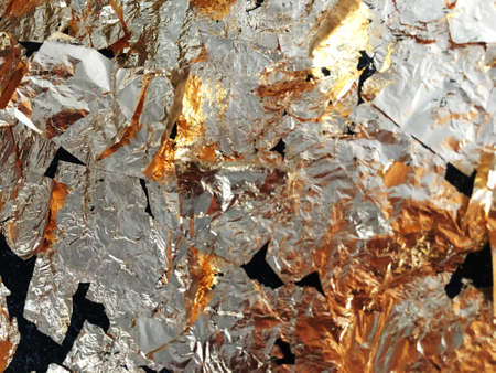 gold textured background from scraps of foil.