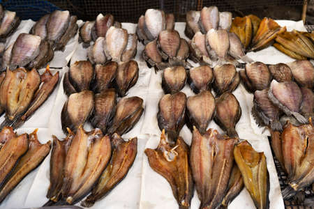 Sun dried trichogaster pectoralis fish on flat bamboo basket, Trichogaster pectoralis in fresh...