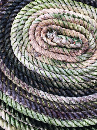 Close up of a rope coiled on a sailboat.