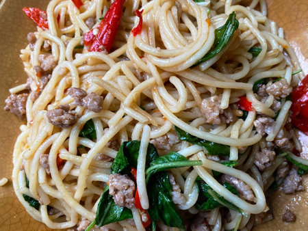 stir fried spicy spaghetti with minced pork and basil,Pad Kra Pao.の写真素材