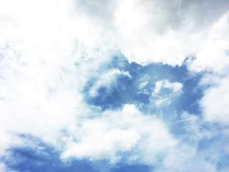 White clouds and blue sky background.