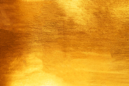 Old glod metal wall background or texture and shadow.
