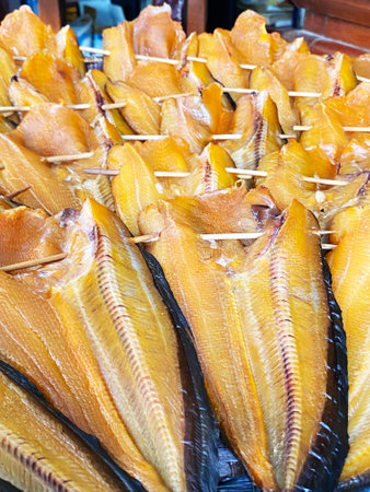 Sun-dried catfish waiting to be sold Dried catfish line up waiting for customers to buy.の写真素材