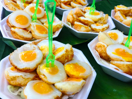 Fried quail eggs at the market.の写真素材