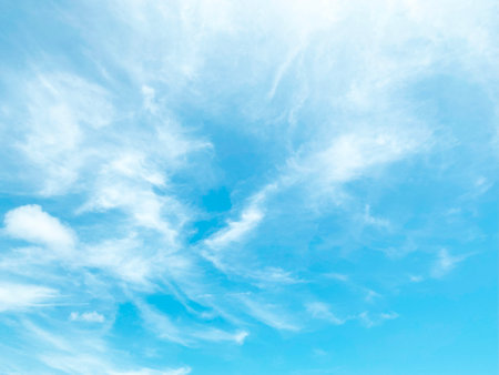 Blue sky background and white clouds soft focus, and copy space.の写真素材