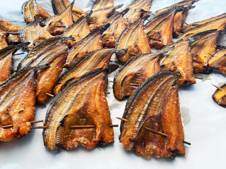 Sun-dried catfish waiting to be sold Dried catfish line up waiting for customers to buy.の写真素材