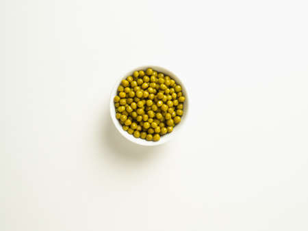 canned green peas in a white bowl on a white table ,, top viewの写真素材