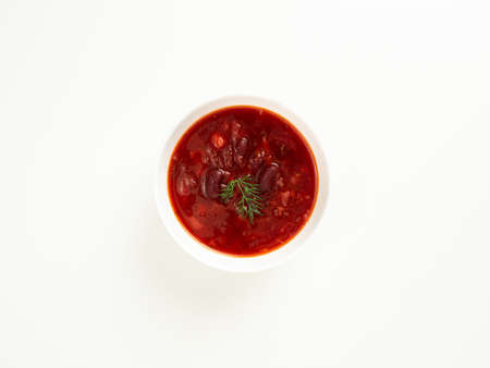 red bean soup in a white bowl on a white table, borsch, top viewの写真素材