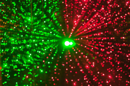 background of green and red bokeh light, diverge from the center of the frameの写真素材