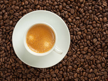 white cup with coffee background.の写真素材