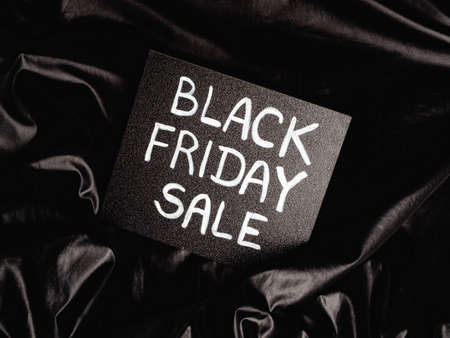 black chalk board with chalk lettering "black friday sale" on black satinの写真素材