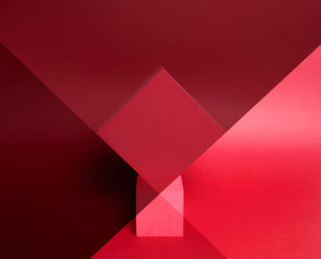 Photo of a bright podium (pedestal) of two cubes on a paper background. In red, with gradient and...