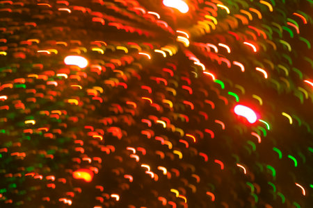 Defocus lights background - blurry defocused zigzag lights shoot out from the center, red, yellow and greenの写真素材