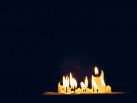 flame of burning candles in the darkの写真素材