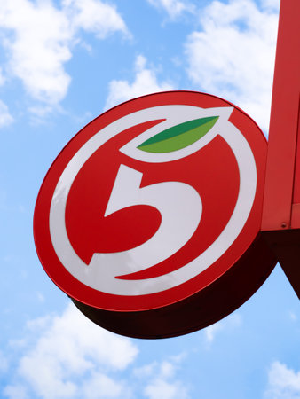 MOSCOW, RUSSIA - JULY 24, 2021: Logo of the brand of the supermarket Pyaterochka against the background of a blue sky with clouds. Pyaterochka is a Russian chain of convenience stores within X5 Groupのeditorial素材
