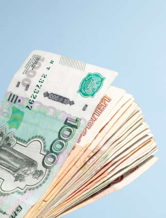 paper money spread out in a fan in denominations of one thousand and five thousand Russian rubles,...