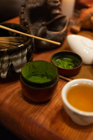 Blurred background - japanese tea party, close-up of objects for the ceremony on a wooden table,...
