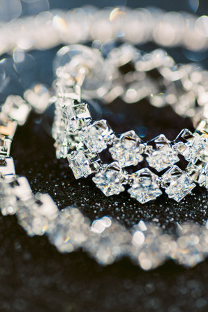 Close up of a diamond bracelet on a black surfaceの写真素材