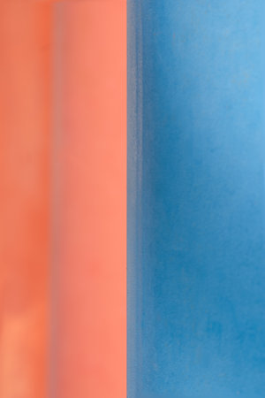 Soft coral orange meets smooth sky blue in a vibrant split composition, creating a serene and...