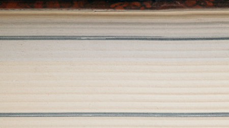 Macro photo of closed book pages, paper texture from the front, backgroundの写真素材