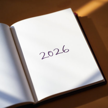 Open notebook rests on a warm toned surface, right page blank except for 2026 written in purple ink. Soft natural light. New plansの素材