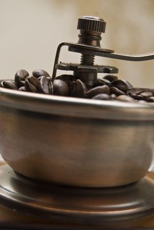 Old-fashioned coffee grinder with coffee beans  の写真素材