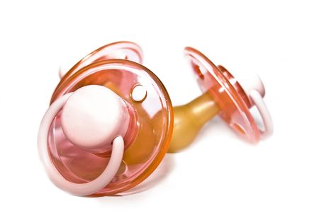 three  pacifier  on white with soft shadow