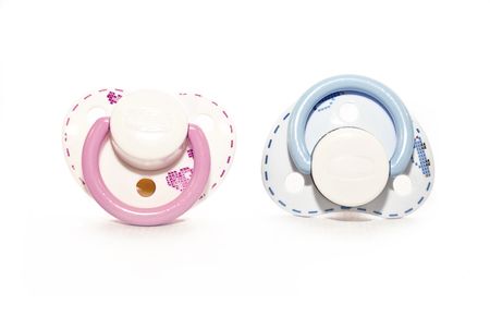 couple  pacifier  on white with soft shadowの写真素材