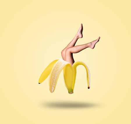 Contemporary art collage. Banana and female legs. Modern food concept.の写真素材