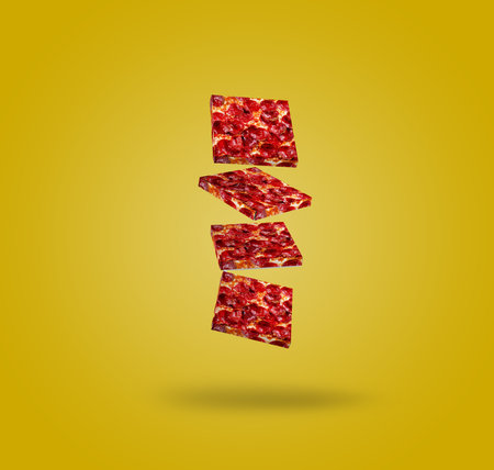Levitating Salami Pepperoni Pizza Boxes. Modern food concept. Photo on a yellow background. Place for text.の写真素材
